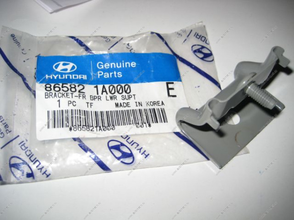 HYUNDAI Accent Кронштейн бампера передний центральный MOBIS  86582-1A000